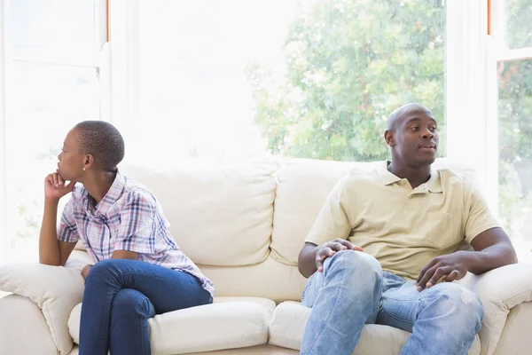 A dispute between a couple sitting on the couch