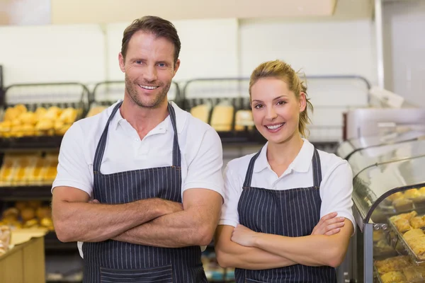 Portrait of a smiling bakers with arms crossed