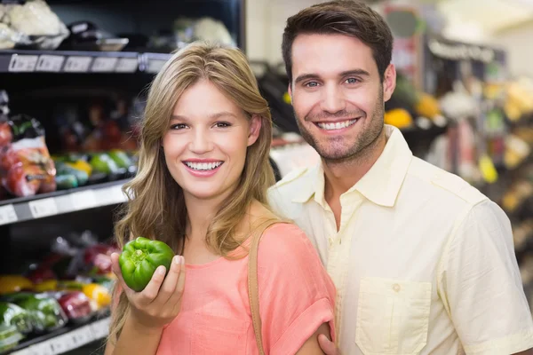 Couple buying food products at supermarket