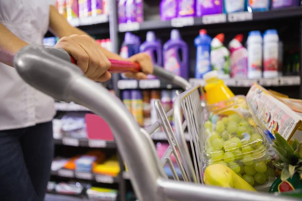 Woman buy products with her trolley