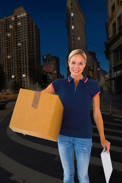 Delivery woman holding cardboard box