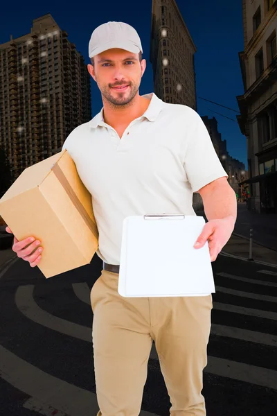 Delivery man with cardboard box