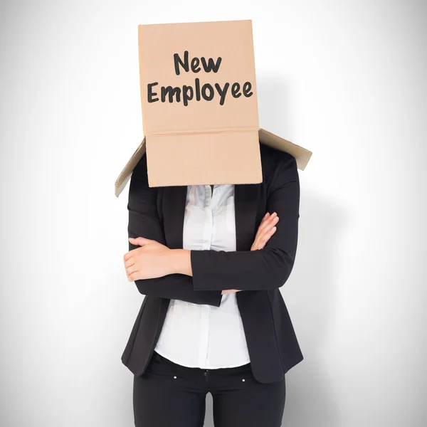 Businesswoman lifting box off head