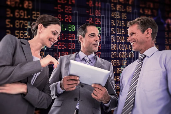 Businessman showing tablet to his colleagues