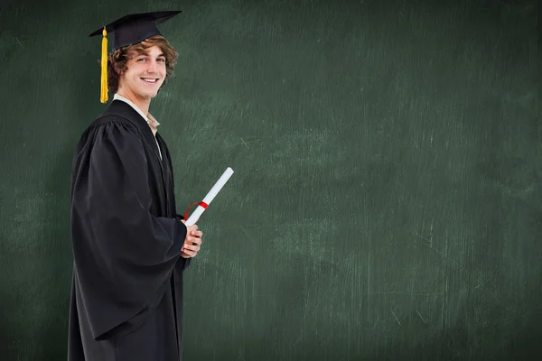 Profile view of a student in graduate robe