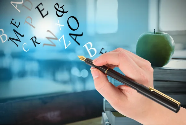 Composite image of businesswomans hand writing with fountain pen