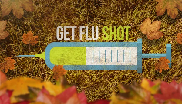 Autumn leaves with flu shot and syringe