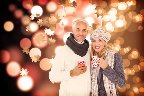 Portrait of happy couple drinking hot coffee