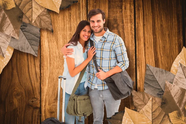 Attractive young couple going on their holidays