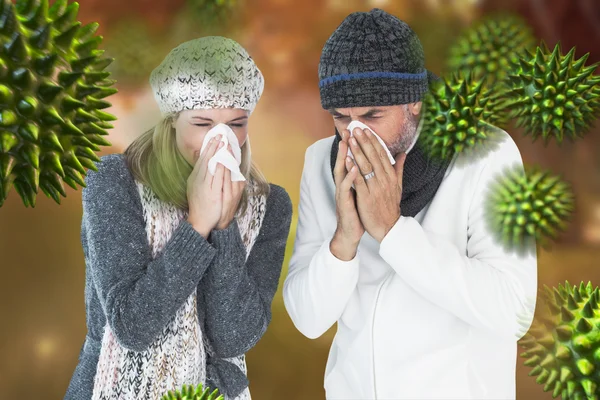Couple sneezing in tissue
