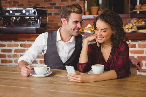 Cute couple having coffee together