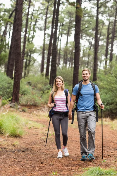 Young happy hiker couple hiking