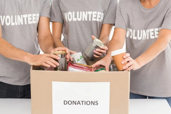 Volunteers sorting donations