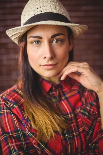 Beautiful hipster looking at camera