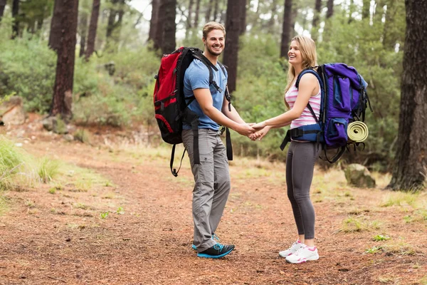 Hiker couple holding hands