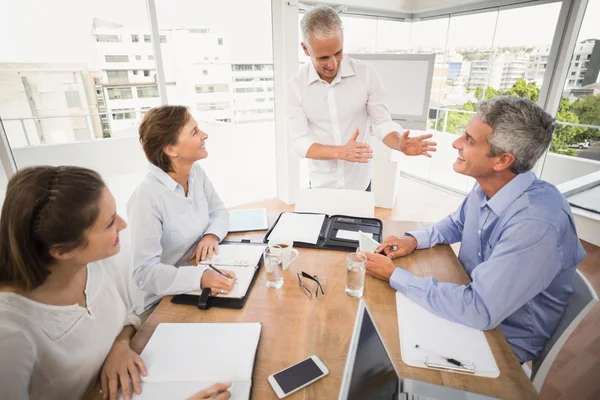 People listening to colleagues presentation