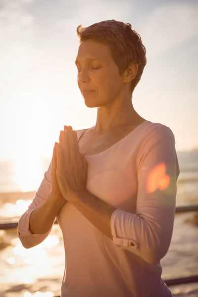 Peaceful sporty woman meditating