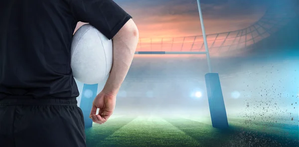 Player holding a rugby ball