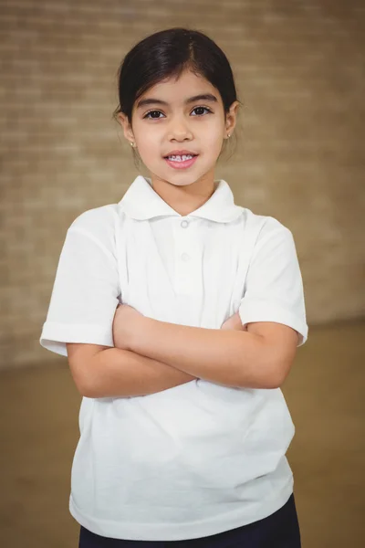 Happy pupil with folded arms