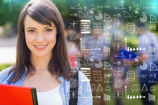 Student smiling at camera outside