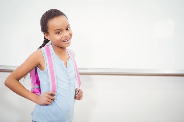 Smiling student wearing a school bag