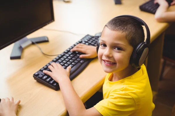 Pupil in computer class smiling