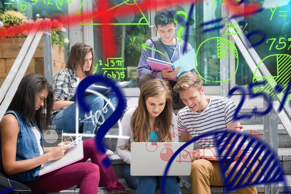 Students sitting on steps studying