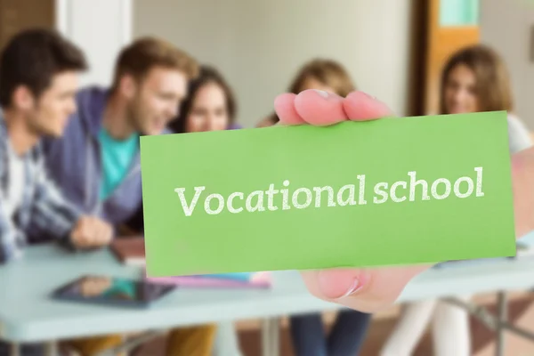 Word vocational school and hand showing card