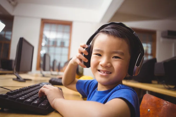 Cute pupil in computer class