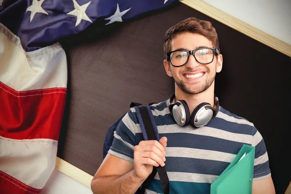 Happy student against american flag