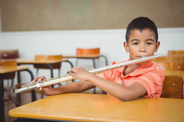 Student using a flute in class