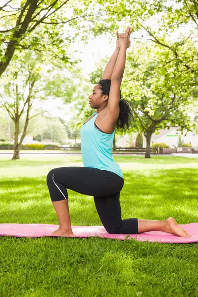 Woman doing yoga on mat
