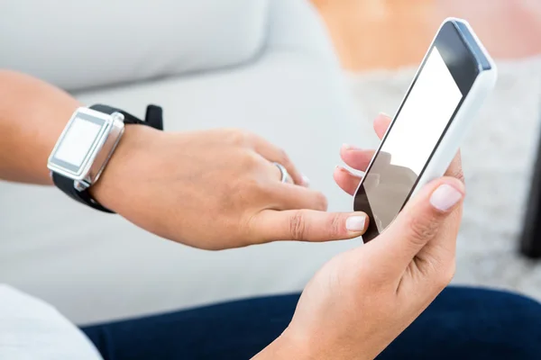 Woman touching mobile screen