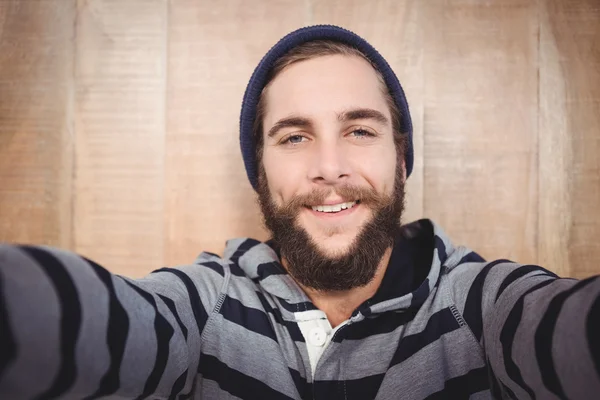 Portrait of happy hipster with hooded shirt