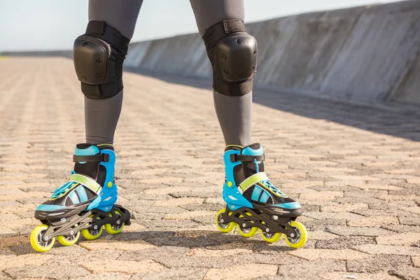 Close up view of woman wearing inline skates