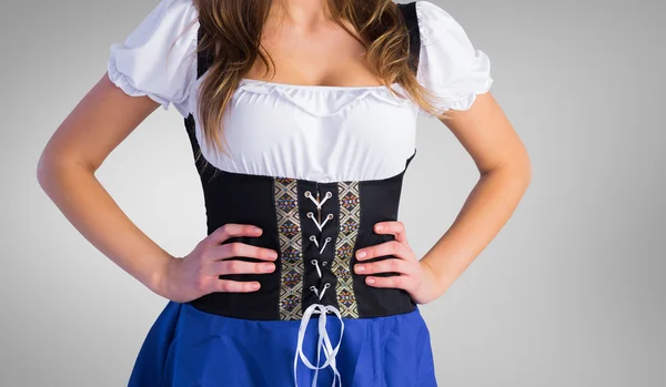 Oktoberfest girl standing with hands on hips