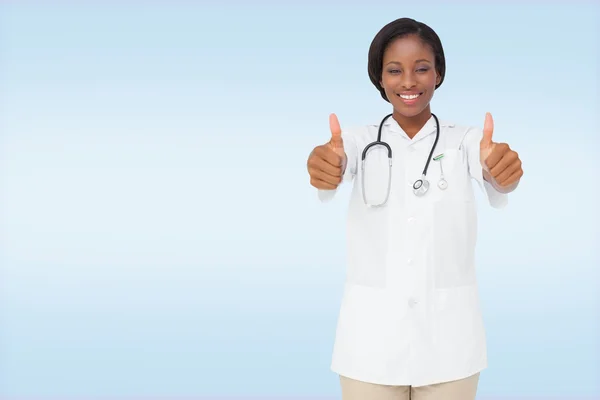 Young nurse giving thumbs up