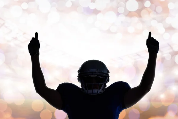 Silhouette of American football player with thumbs up