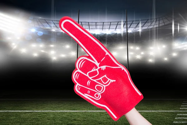 American football player holding supporter foam hand