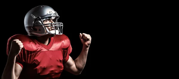 American football player cheering with clenched fist