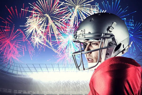 American football player against fireworks