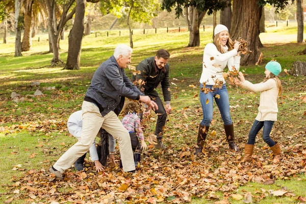 Happy family playing in the park together