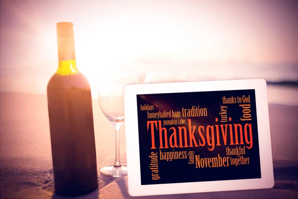 Thanksgiving words against bottle of wine
