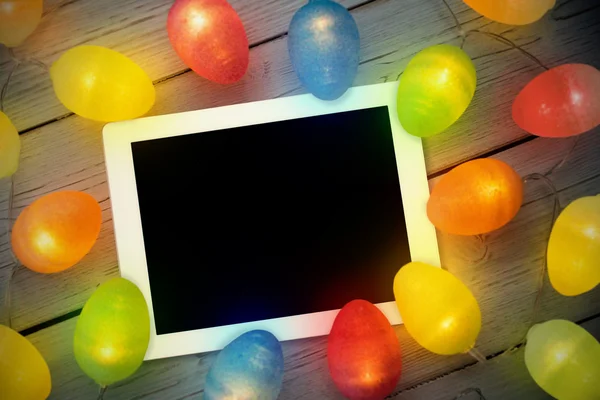 Tablet pc against christmas lights
