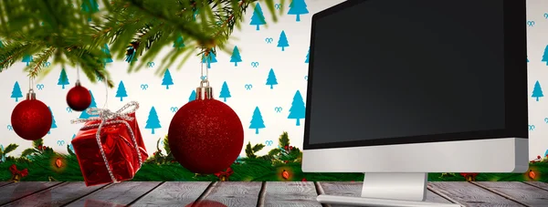 Decorations on tree against computer