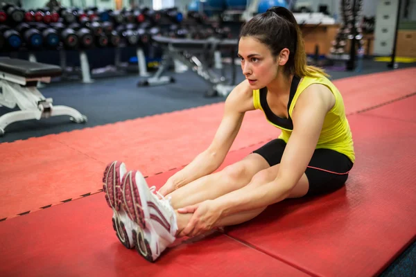 Woman doing warm up exercises