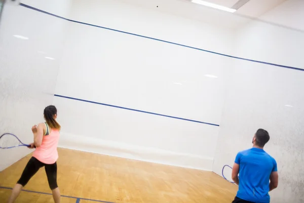 Couple enjoying a game of squash