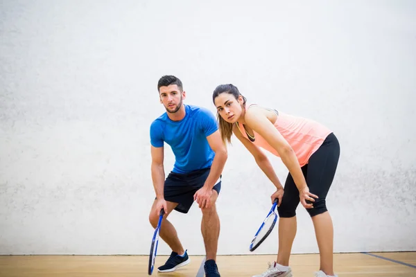 Couple tired after a squash game