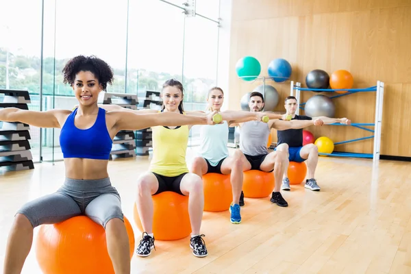 Fitness class exercising in the studio