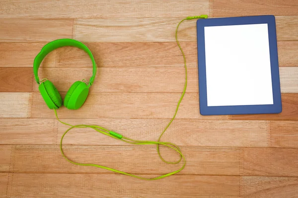 Green headphone with a blue tablet